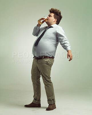 Buy stock photo Studio, drunk and man with beer or alcohol with pint glass to drink, professional and profile. Adult, male person and guy with beverage for break, fun and crazy in party with liquid from mug

