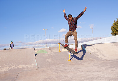 Buy stock photo Fitness, freedom and man with skateboard, jump or rail balance at a skate park for stunt training. Energy, adrenaline and gen z male skater with air, sports or skill practice, exercise or performance