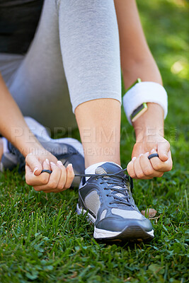 Buy stock photo Sneakers, hands and tie shoelace in park, ready for run or cardio for fitness and sports outdoor. Exercise, workout and person with shoes on grass for training, health and wellness with runner