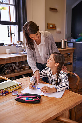 Buy stock photo Studying, mother and daughter with books for help, advice and happy for homework with education. Mom, girl and notebook with drawing, notes and development with learning in kitchen at family house
