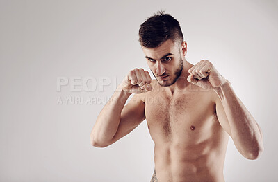 Buy stock photo Fitness, MMA and portrait of male fighter for martial arts, boxing and angry on white background. Fist, athlete and exercise for man kickboxer, studio and training for impact sports competition 