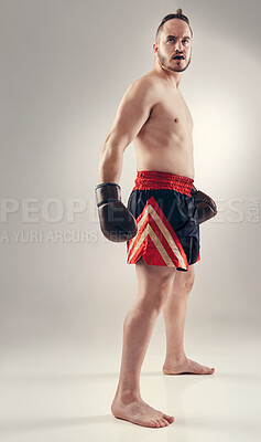 Buy stock photo Sports, man and body of boxer for fitness in studio isolated on a white background mockup space. Serious fighter, athlete and person in gloves for exercise, workout or thinking of training for health