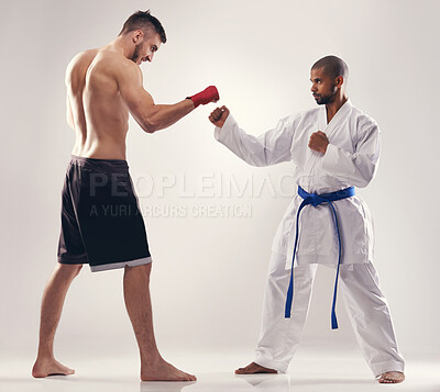 Buy stock photo Karate, mma and men fight in competition, exercise or training body in studio isolated on a white background. Sports, martial arts and people sparring in battle for challenge or workout for fitness