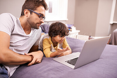 Buy stock photo Family, father and son with laptop in bed for cartoon, movie and connectivity with technology for online streaming. People, man and child at home with computer or internet for bonding in house