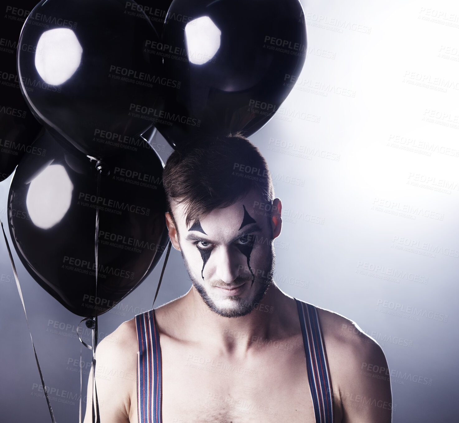 Buy stock photo Man, circus and topless for theatre performance on dark background with light for stage, creative and entertainment. Portrait, mime and performer with balloons, face paint and  tattoo for creativity 