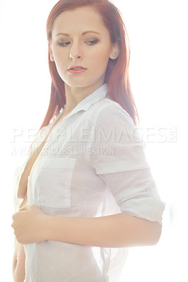 Buy stock photo Woman, thinking and sexy or seductive with shirt for temptation, flirty and sensual in bedroom with confidence. Girl, unbutton and home for desire or sensuality, alluring and hot with cleavage.