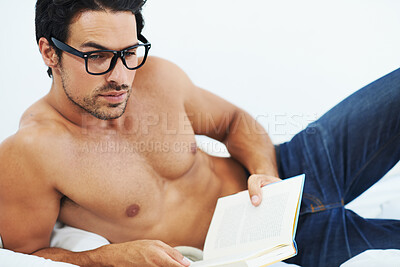 Buy stock photo Bed, relax and man with tattoo, book and reading with glasses, thinking and cozy, home and apartment. House, bedroom and male person with eyewear for vision, muscle and novel of fiction and art