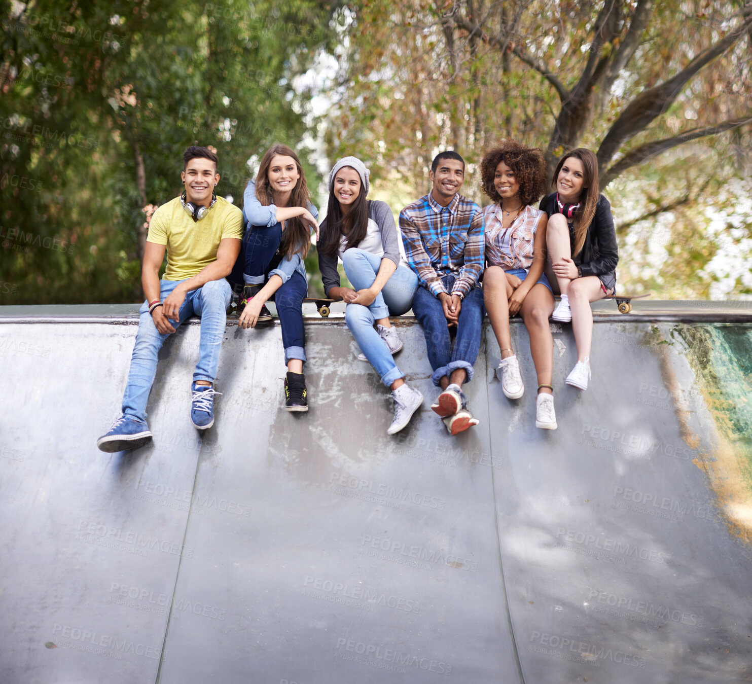 Buy stock photo Serious, portrait and group of friends at skatepark for bonding, skating and sitting together. Gen z, diversity and young people with skateboard for practice or training for competition together.
