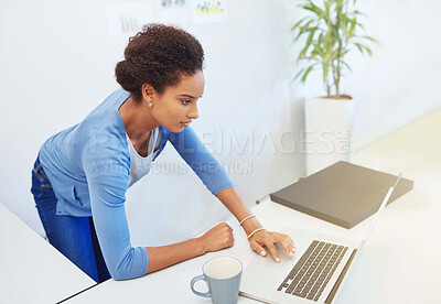 Buy stock photo Cropped shot of a young architect working on her laptop