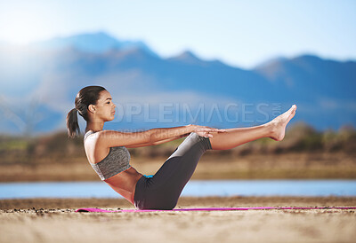 Buy stock photo Shot of a young woman exercising outdoors