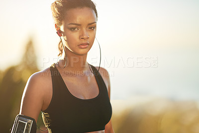 Buy stock photo Portrait, girl and running with outdoor, cardio and blurred background for endurance, training and exercise. Athletic, health and work out with arm pouch, earphones and fitness listening to music