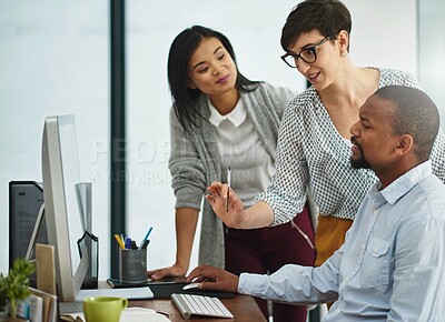 Buy stock photo Cropped shot of two businesspeople working in the office