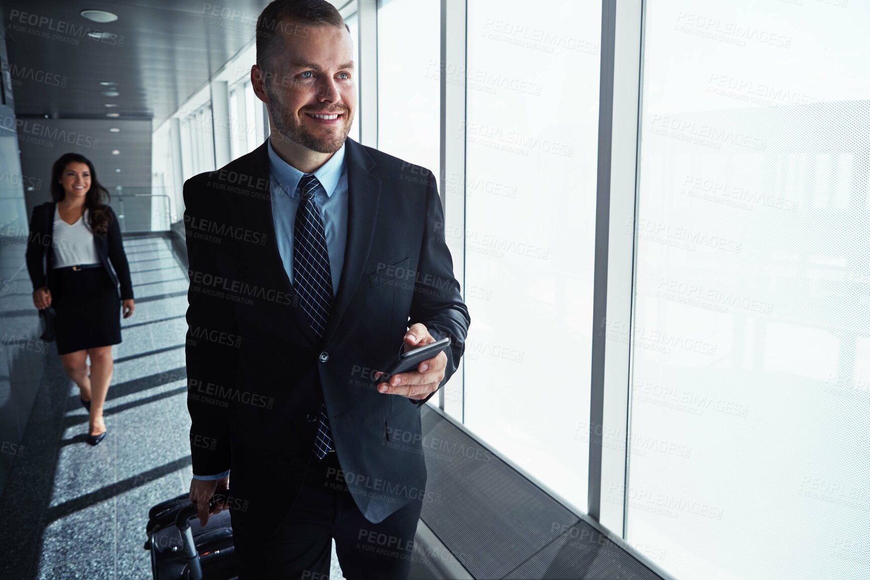 Buy stock photo Business man, woman and phone by airport window for vision, thinking and contact in corridor with smile. Entrepreneur, suitcase and smartphone with flight schedule for global immigration in London