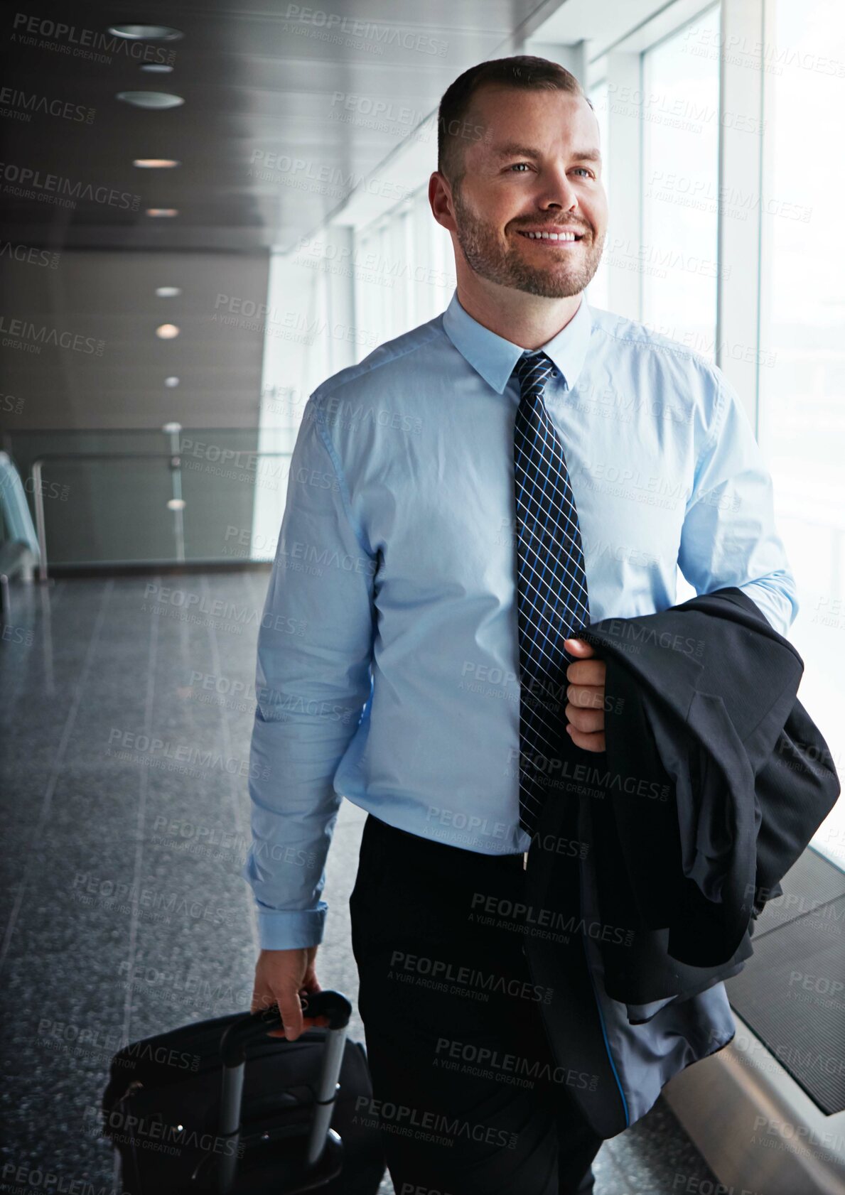 Buy stock photo Walking, happy or man in airport thinking of company trip with suitcase or luggage for commute. Proud businessman, smile or corporate worker in hall for journey, flight or international travel 