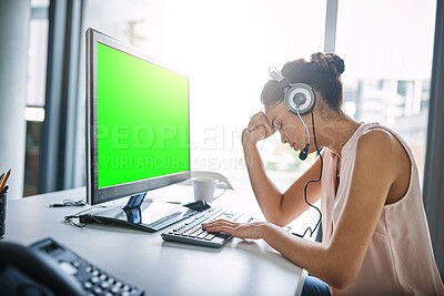 Buy stock photo Cropped shot of an attractive young woman looking stressed while working in a call center