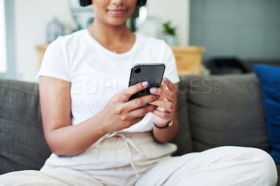 Buy stock photo Phone, hands and woman on social media in home for internet, blog or typing email. Smartphone, fingers and person on sofa to relax in living room on app, scroll or communication on digital technology