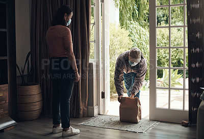 Buy stock photo Woman, package and mask in house for health, courier service and customer care with safety. Delivery man, parcel and female person with face protection in home for ocd, bacteria and virus anxiety