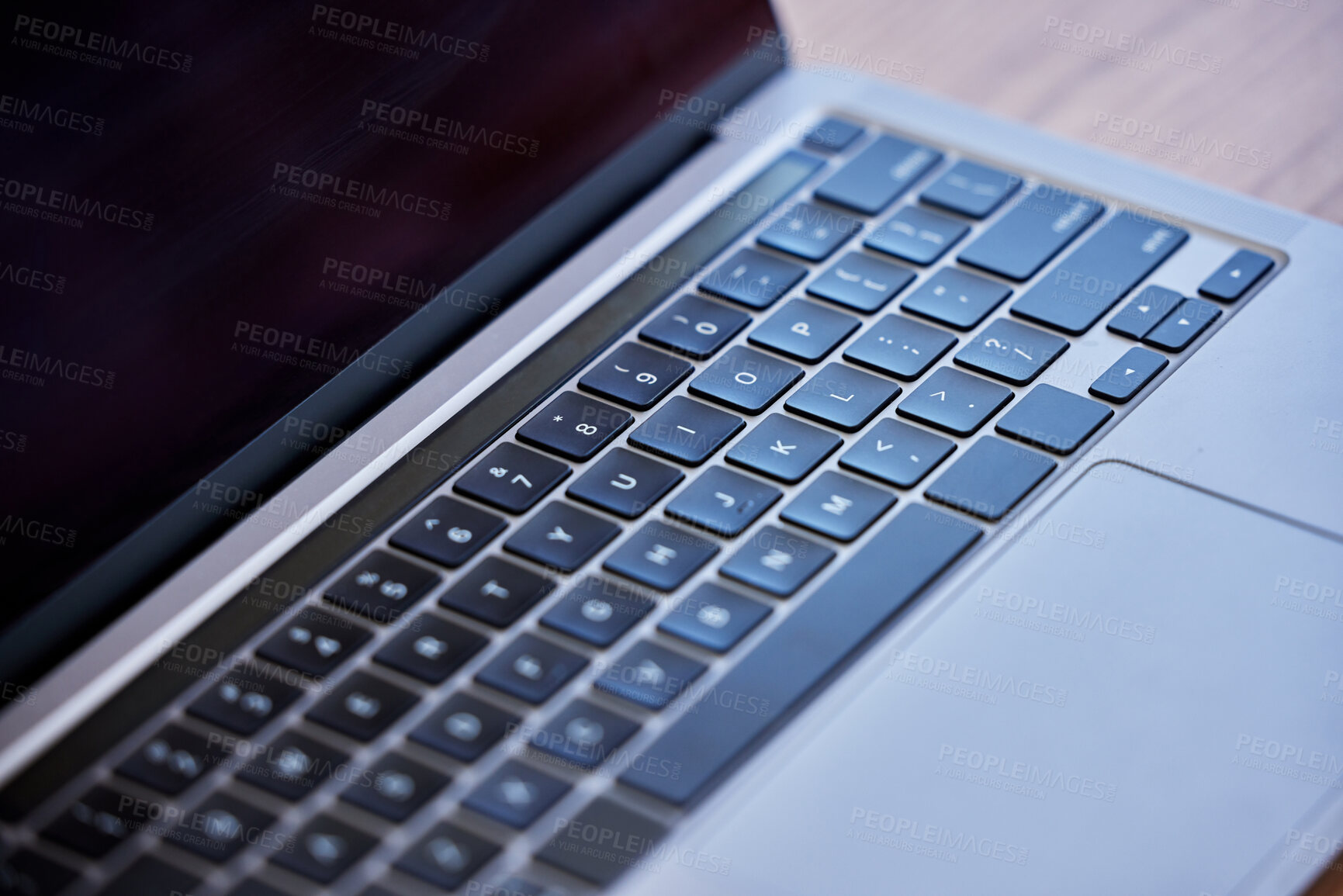 Buy stock photo Shot of a laptop on a desk in an empty office during the day