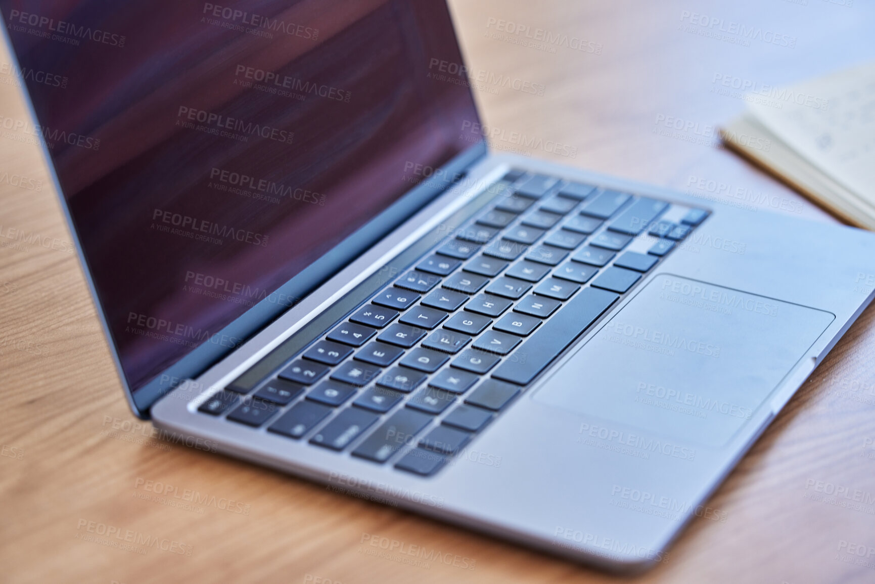 Buy stock photo Shot of a laptop on a desk in an empty office during the day