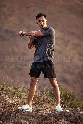 Buy stock photo Athlete, male person and fitness on mountain by stretching in outdoors for exercise, training and workout for health. Active and man in Mexico on path for muscles, wellness and calm in nature