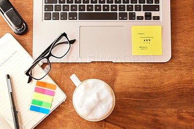 Buy stock photo Top view, stationary and laptop on table with coffee in morning for daily routine to start studying for test. Caffeine beverage, desk and technology for internet, search and journal for notes on exam