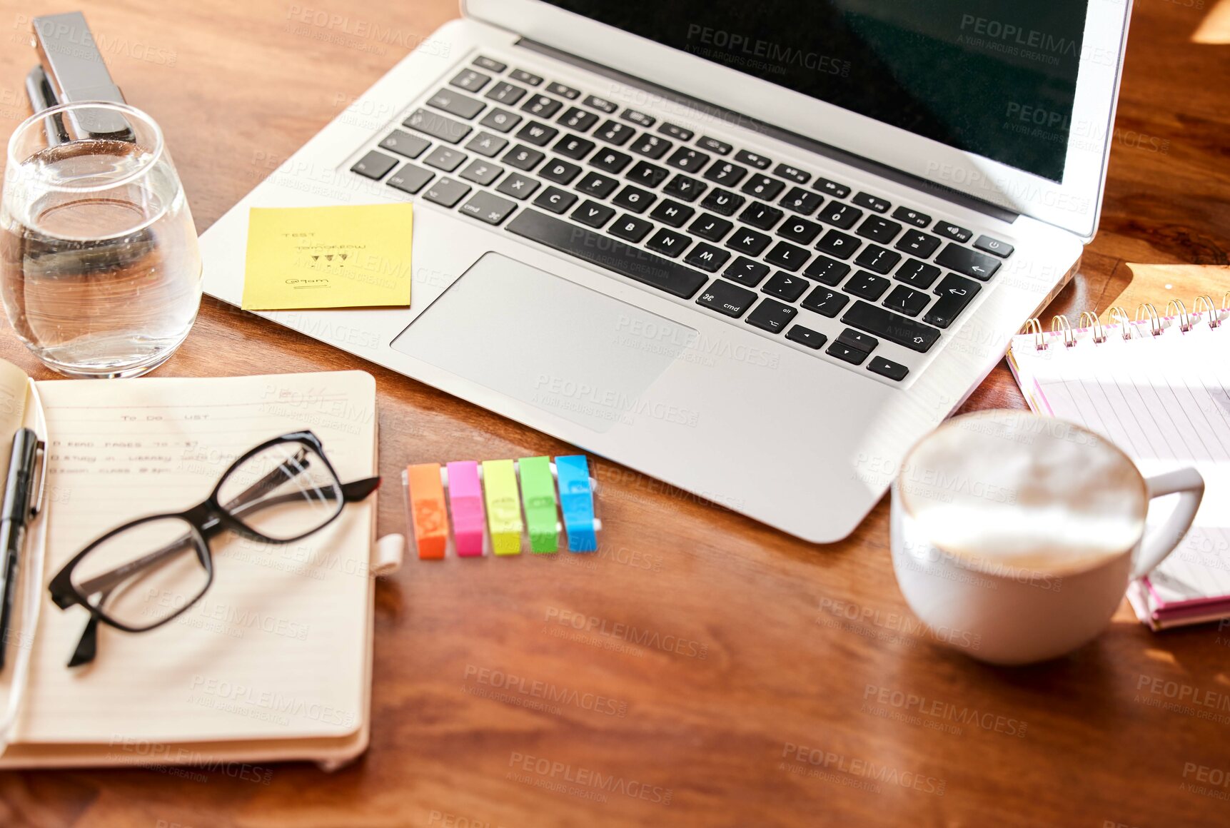 Buy stock photo Top view, stationary and laptop on desk with coffee in morning for daily routine to start business work. Caffeine beverage, table and technology for internet, search and journal for schedule or notes