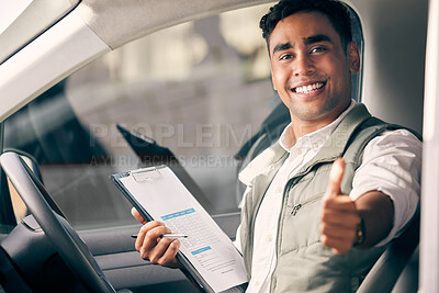 Buy stock photo Shot of a delivery man holding a clipboard and showing thumbs up while sitting in his vehicle