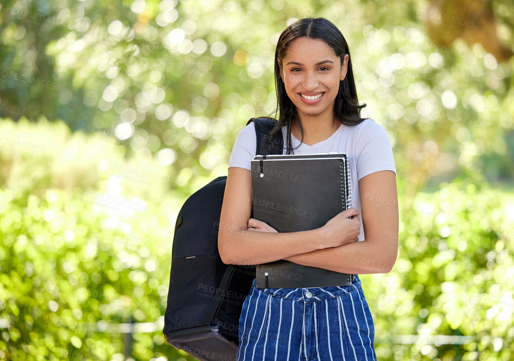 Buy stock photo Smile, female student and campus with book in portrait for learning, education and knowledge for goal growth. Woman,  school and study at university with information or notes for future development