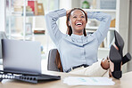Business Woman relaxing with her feet on her desk. African american entrepreneur taking a break from work.Cheerful woman resting at work. Happy female relaxing and looking satisfied at her desk after work