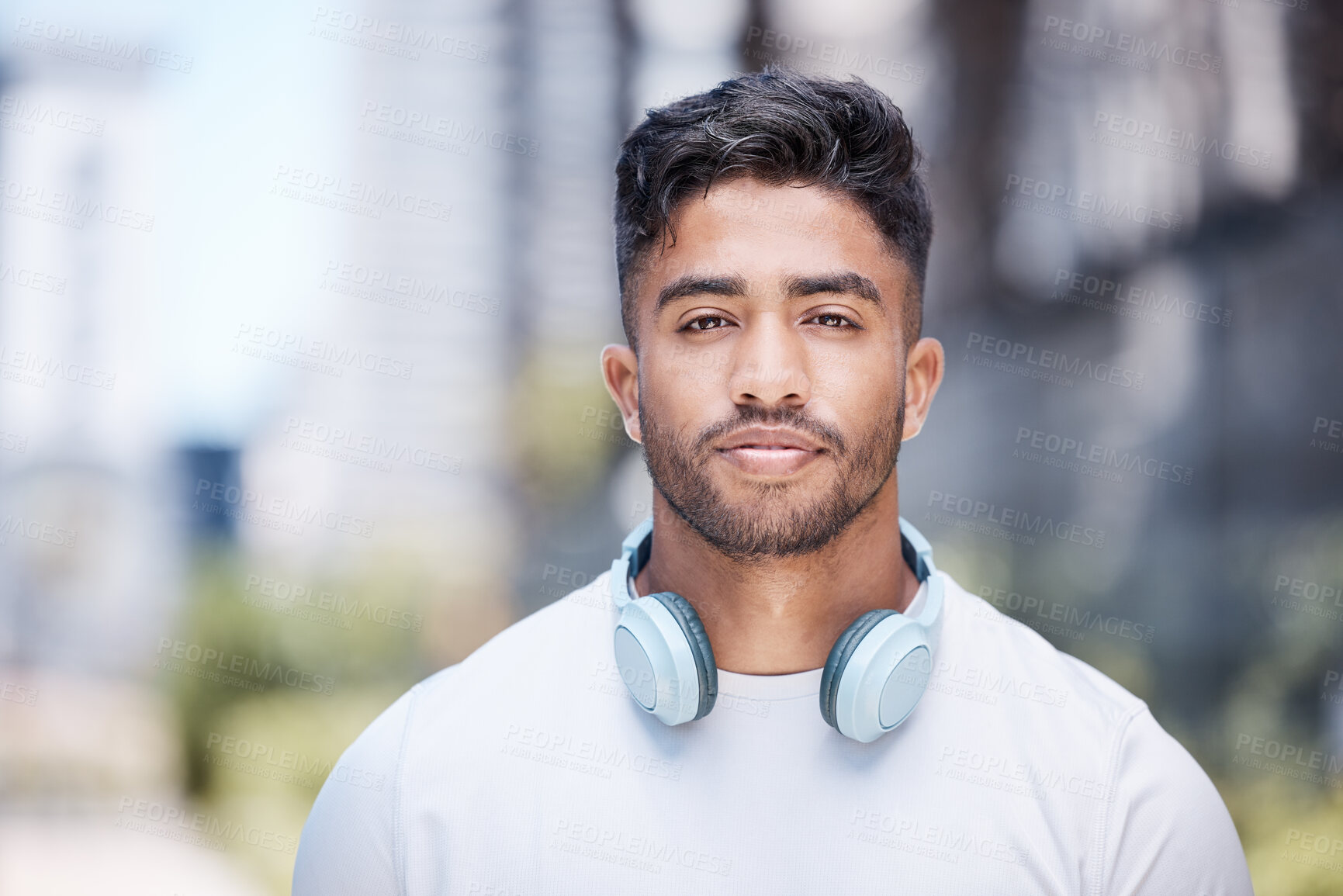 Buy stock photo Man, portrait and headphones outdoor for fitness, music or audio streaming with personal trainer in city. Confident, proud and athlete with wireless tech for radio, podcast or playlist with training