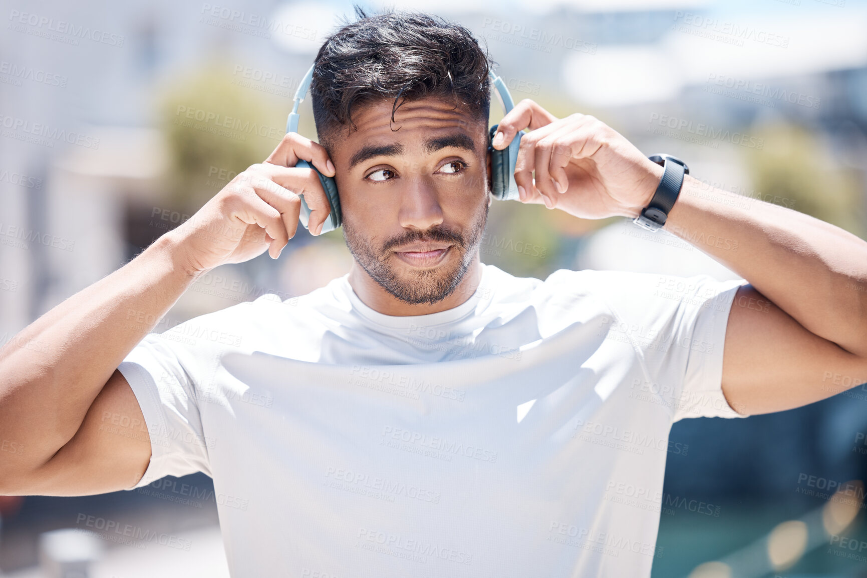 Buy stock photo Man, listening and headphones outdoor for fitness, music or audio streaming with personal trainer in city. Confident, proud and athlete with wireless tech for radio, podcast or playlist with training