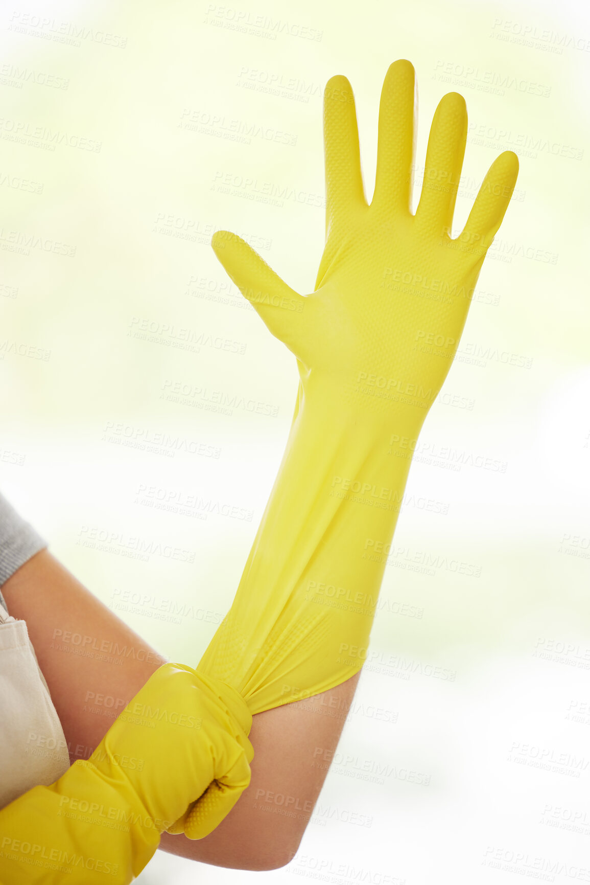 Buy stock photo Person, hands and cleaner with gloves for cleaning, housekeeping or disinfection at home. Yellow closeup of maid or domestic worker getting ready with protection for health and safety from bacteria