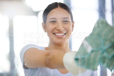Buy stock photo Happy woman, housekeeping and cleaning window with cloth for disinfection, hygiene or health and safety at home. Female person, domestic or young maid with smile for glass surface or cleaner service