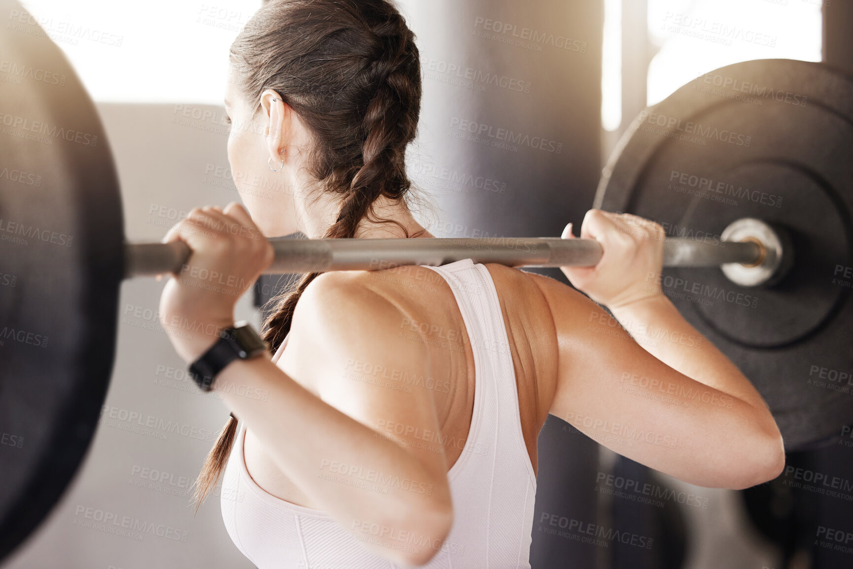 Buy stock photo Gym, fitness and woman with barbell for training, exercise or workout, progress and body transformation. Sports club, back and power athlete with weightlifting, deadlift and never give up resilience