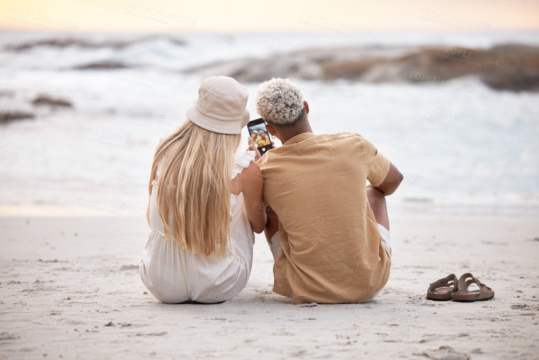 Buy stock photo Phone screen, selfie or couple at beach with love, trust or peace while bonding in nature together. Travel, relax or back of people with sunset date for romantic, photography or ocean profile picture