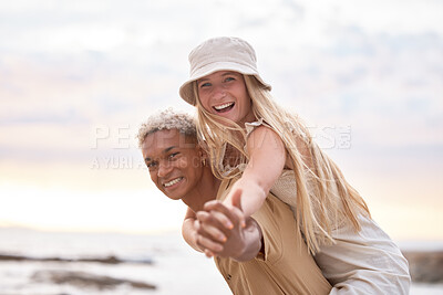 Buy stock photo Portrait, love or piggyback by coupe at beach for fun, adventure or bonding at sunset together. Freedom, interracial relationship or people holding hands at sea for energy, celebration or Mexico trip