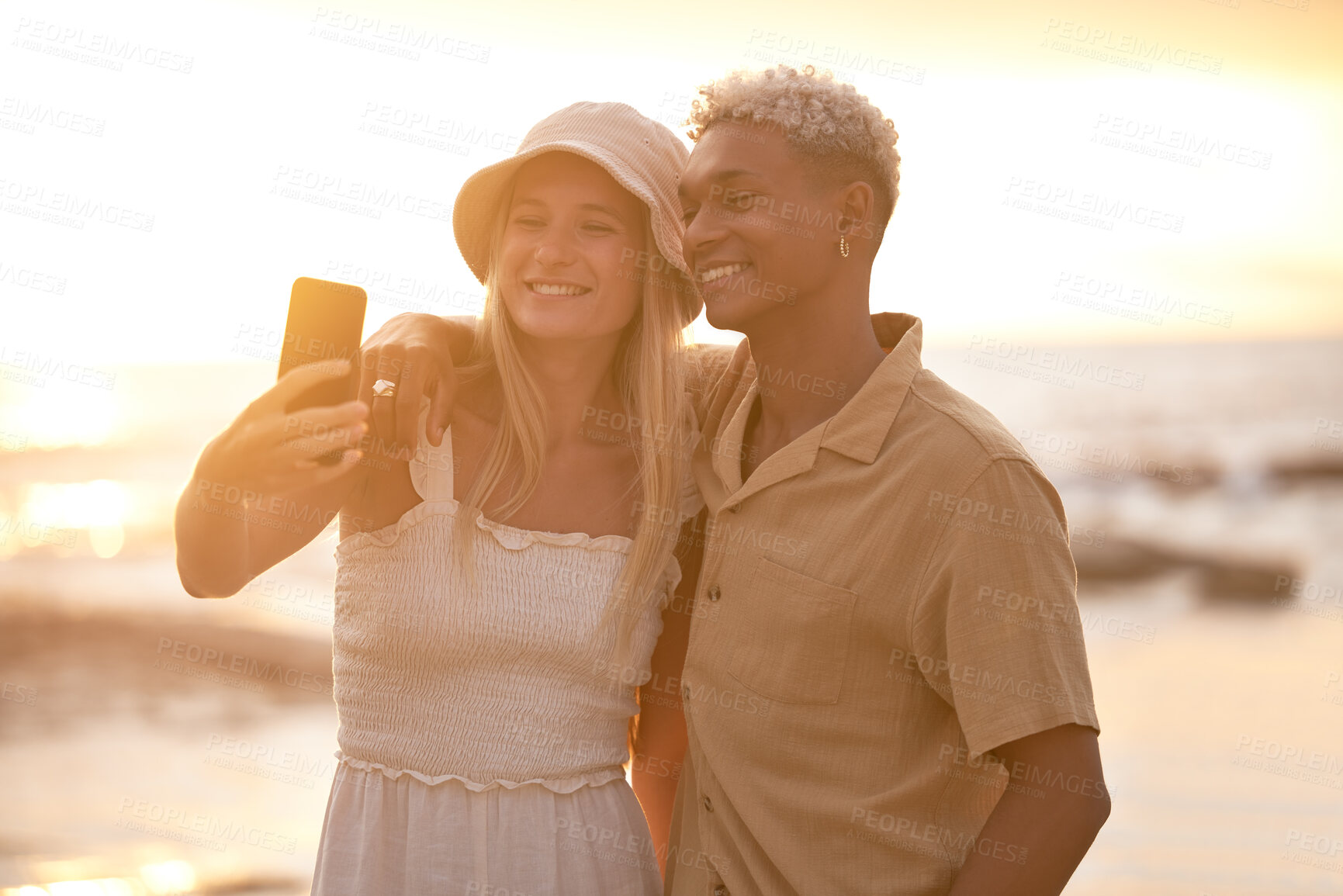 Buy stock photo Beach, couple and sunset selfie for love, trust or peace while bonding in nature together. Travel, smile and gen z people hug with sunrise date for romantic, photography or ocean profile picture