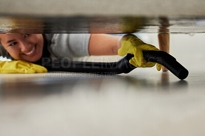 Buy stock photo Woman, vacuum and cleaning under sofa in living room for dust, hygiene and housekeeping in home. Maid, domestic worker or female person with appliance for service, remove dirt or household chores