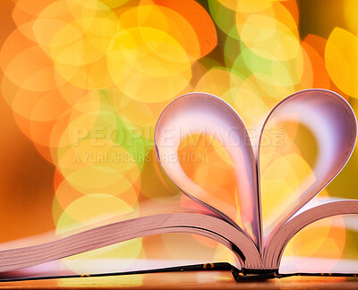 Buy stock photo Bokeh, blurred background and open book with heart for love of reading, education and knowledge with light. Color, shape or emoji for studying, homework and learning material with care on paper