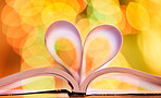 I love reading books and doing my homework! A schoolbook with open pages forming a heart sign. Motivation and hard work makes for great grades and a good education. 