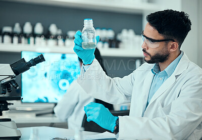 Buy stock photo Science, safety and man with bottle in laboratory, research and medical engineering with sample. Biotechnology, vaccine study and liquid, scientist or lab technician checking solution in glass jar.