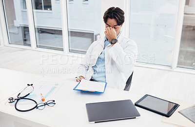 Buy stock photo Healthcare, doctor and man with a headache, stress and overworked with burnout, surgeon and tired. Person, employee and medical professional with a migraine, fatigue and exhausted in a hospital