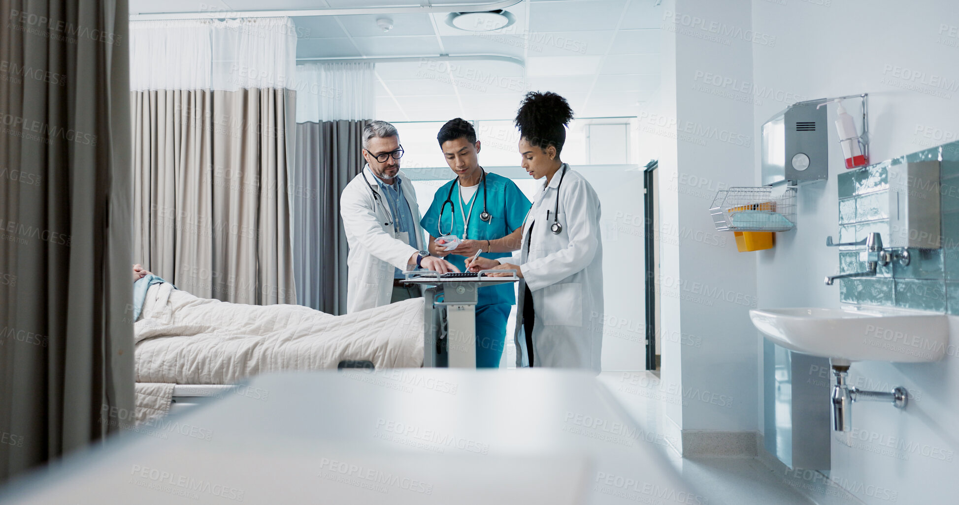 Buy stock photo Healthcare, hospital and a medical team of doctors checking on a patient in recovery or rehabilitation. Medicine, teamwork and consulting with a group of health professionals in a clinic for wellness