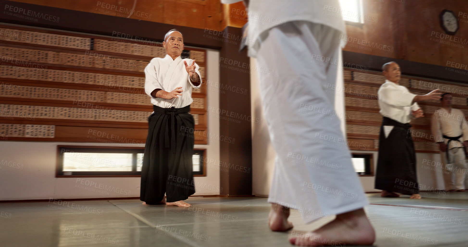 Buy stock photo Japanese students, aikido or sensei in dojo to start practice lesson, discipline or teaching self defense. Black belt master, people learning combat or athletes in fighting class, training or sports