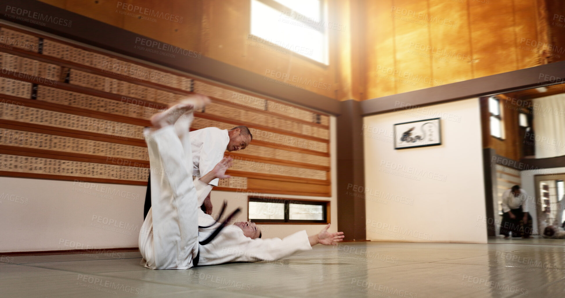 Buy stock photo Black belt students, throw or sensei in dojo to start practice lesson, discipline or teaching self defense. Japanese master, people learning combat or athletes in fighting class, training or aikidoka