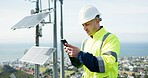 Man, phone and engineer for social media, research or alternative energy and maintenance or inspection on rooftop. Person, contractor or technician on mobile smartphone for communication in city