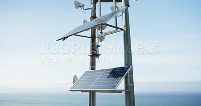 Solar panel, energy and roof with ocean, sky and horizon with sustainability, power or off grid development. Photovoltaic tech, electricity and outdoor with ecology for environment by sea in Tokyo