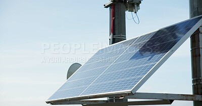 Solar energy, industry and roof with sky background, closeup and sustainability for power in off grid development. Photovoltaic tech, electricity and outdoor with ecology for environment in Tokyo