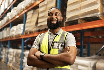 Black man, portrait and smile with confidence in warehouse for logistics, supply chain or storage management. African male person or happy employee with arms crossed in shipping industry at depot