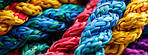 Rainbow, pattern and bundle of rope with texture, color and knot for climbing, safety or strong connection. String, thread or craft yarn on wallpaper with abstract textile, lines or network diversity